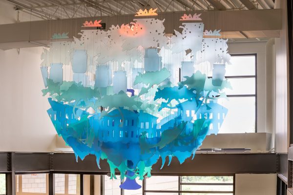 Image of a suspended sculpture, rendered in blue, teal, and white in the Smith Spring Community Center.