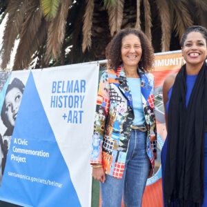 Allison Rose Jefferson and April Banks pose in front of a construction banner at Historic Belmar Park in 2020. Photo by Leroy Hamilton.